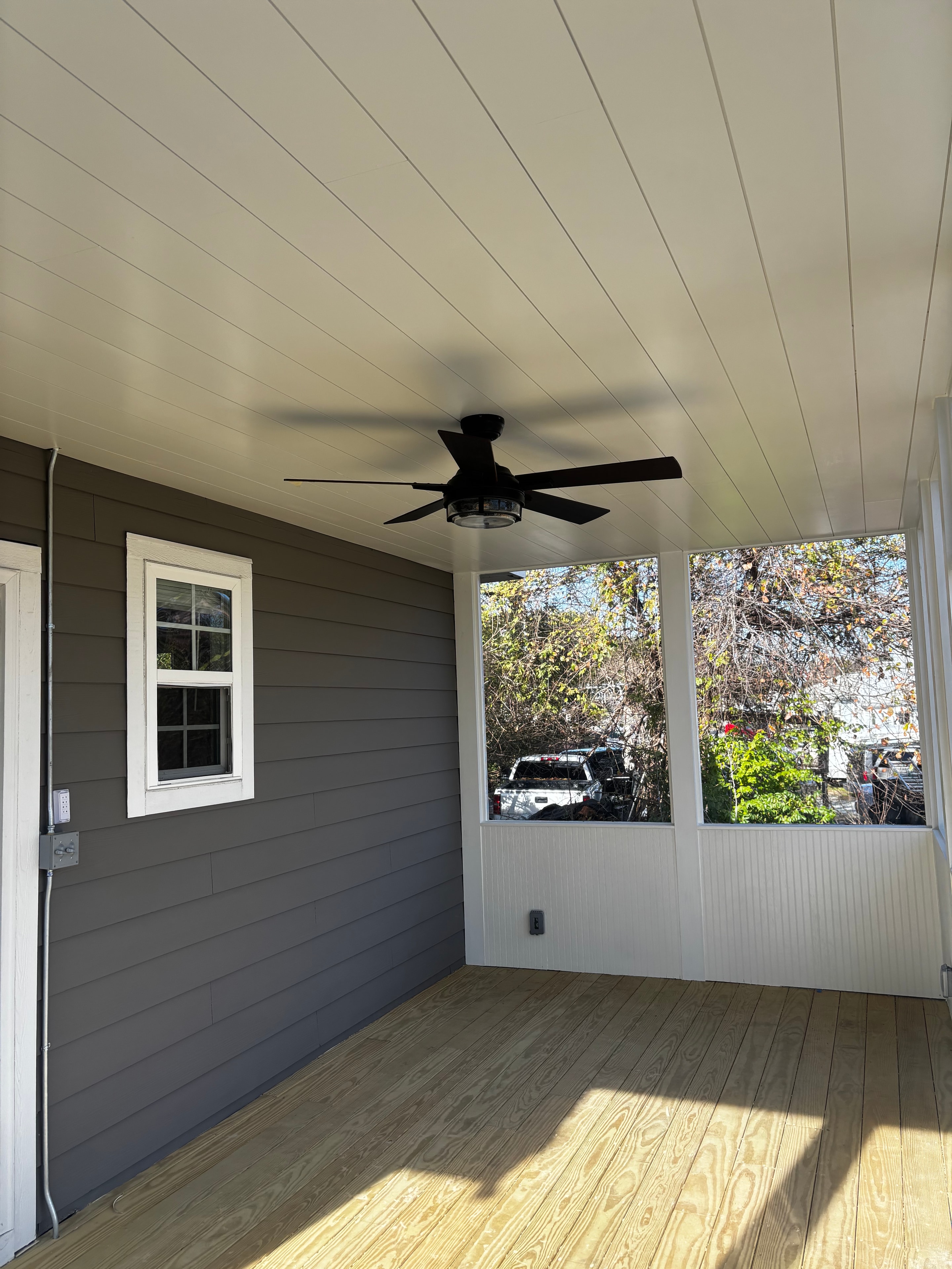 Covered screened porch with ceiling fan